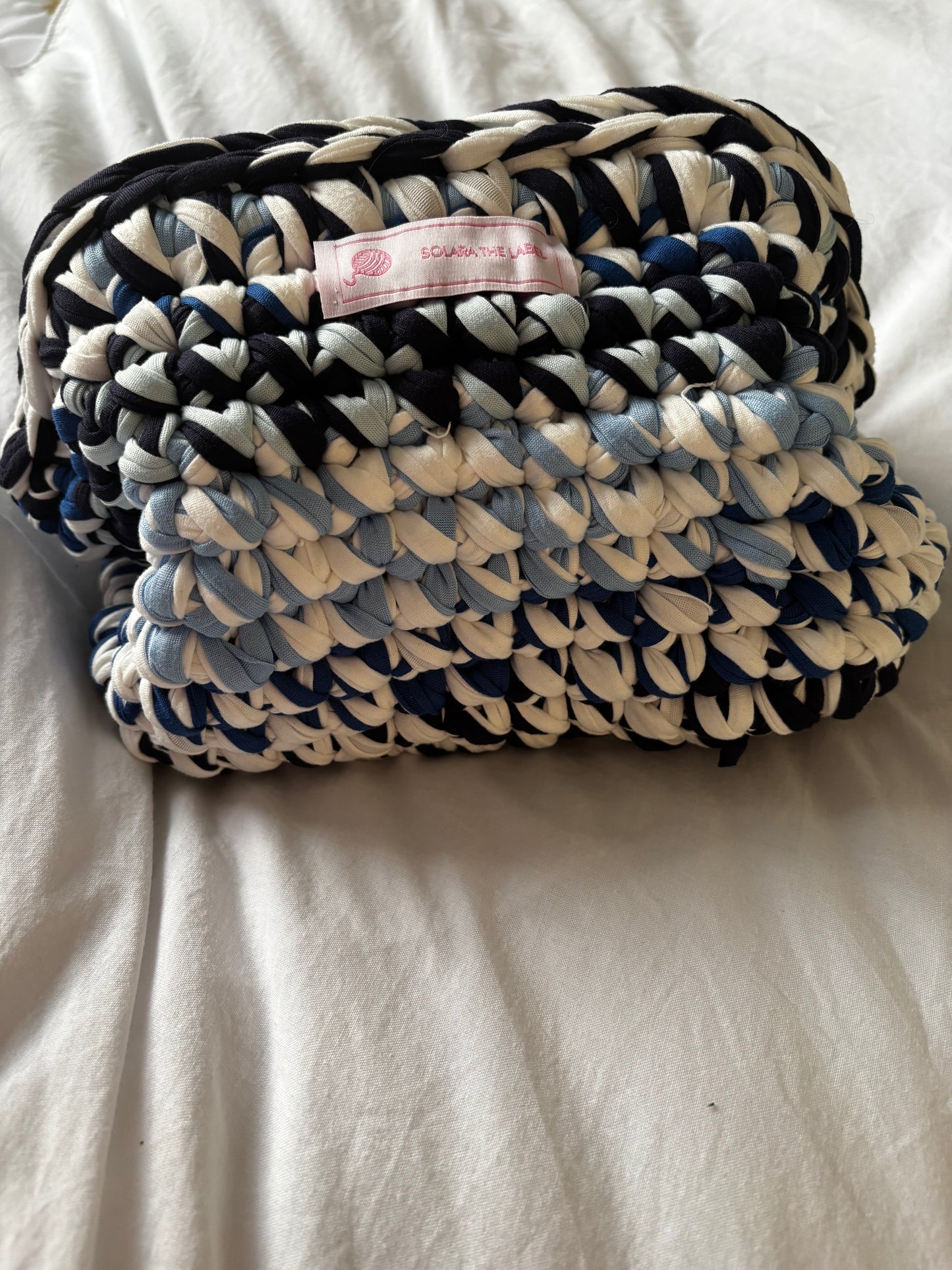 Blue mirage clutch bag